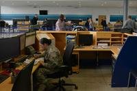 Travelers in military space available flight terminal